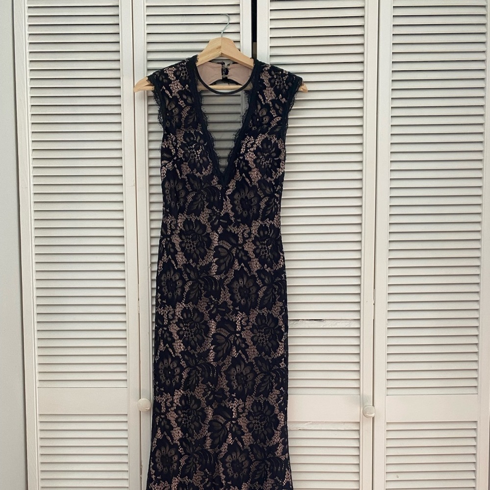 Beautiful evening gown. Very flattering and classy. Only worn once.